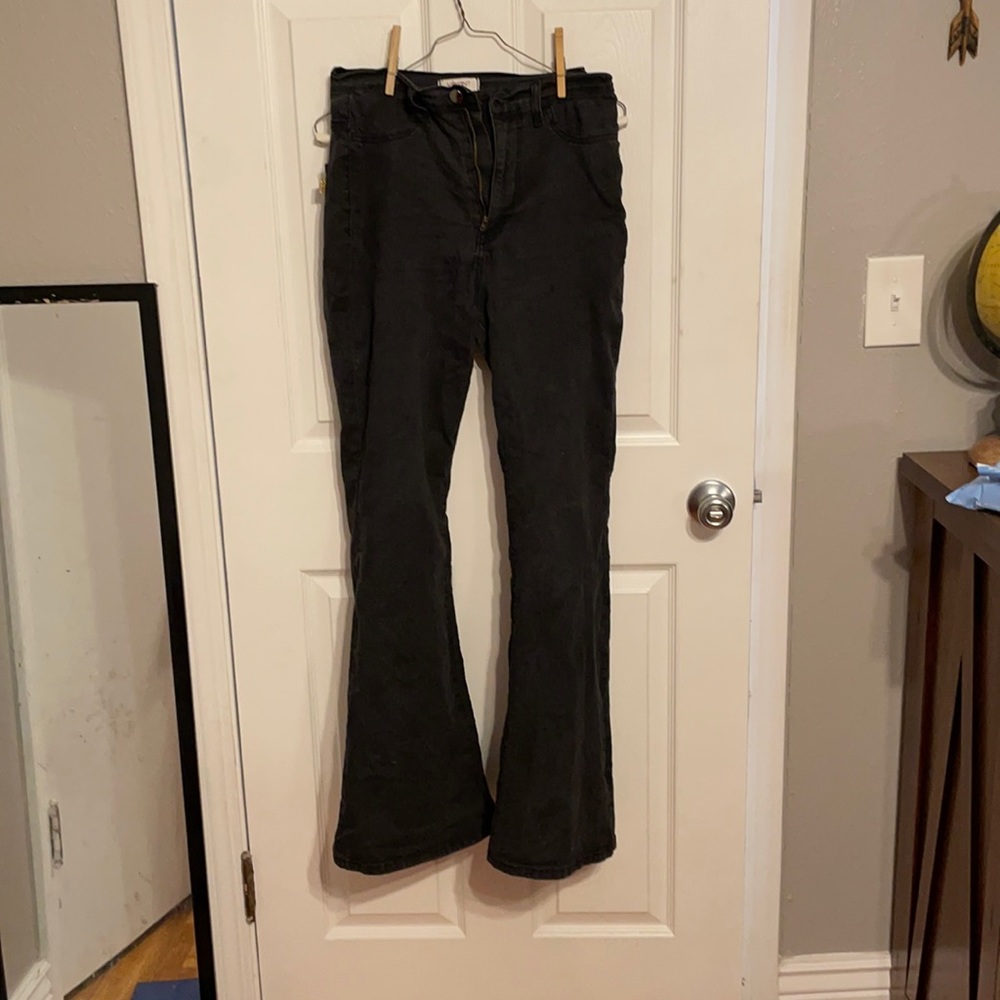 Faded black flare jeans. Size 13, wear size 11.